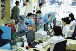 Tính đến cuối năm 2021, dư nợ cho vay nền kinh tế của BIDV đạt 1,33 triệu tỷ đồng. Ảnh: Đức Thanh