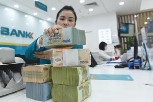 Nhiều ngân hàng chủ động tăng trích lập dự phòng để hạn chế rủi ro nợ xấu tăng. Ảnh: Dũng Minh