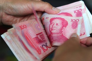 Đồng nhân dân tệ giao ngay mở cửa phiên giao dịch 13/2 ở mức 6,8349 CNY đổi 1 USD. Ảnh: AFP