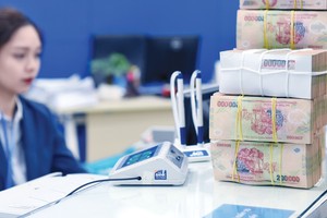 Tính đến cuối tháng 6/2023, tổng dư nợ (gốc, lãi) được cơ cấu giữ nguyên nhóm nợ của ngành ngân hàng theo Thông tư 02 là gần 62.500 tỷ đồng. Ảnh: Dũng Minh
