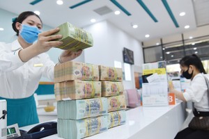 Biên lãi ròng bình quân ngành ngân hàng trong quý II/2023 là 3,43%. Ảnh: Dũng Minh