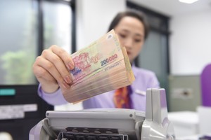 Với các doanh nghiêp địa ốc, tín dụng ngân hàng là nguồn vốn rất quan trọng. Ảnh: Dũng Minh