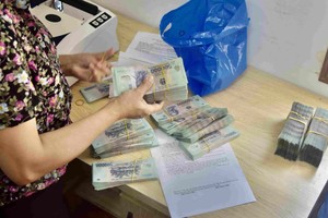 Việc thanh toán qua chuyển khoản sẽ giúp các cơ quan chức năng dễ thu thập nguồn dữ liệu về giá bán. Ảnh: Thanh Vũ