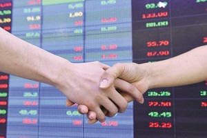 Xu hướng M&A các công ty chứng khoán được dự báo còn tiếp tục trong thời gian tới. Ảnh: D.M