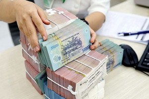 Việc bỏ "room" tín dụng được kỳ vọng sẽ tạo động lực cho tăng trưởng kinh tế. Ảnh: Tin nhanh chứng khoán