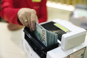 Việc nới tỷ giá sẽ mở ra không gian để NHNN linh hoạt điều hành chính sách tiền tệ. Ảnh: Đức Thanh