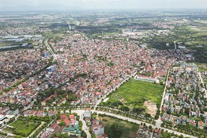 Tại Kỳ họp thứ chín của Quốc hội, Bộ trưởng Bộ Tài chính thừa ủy quyền của Thủ tướng Chính phủ trình Quốc hội sửa đổi, bổ sung một số điều của Luật Quy hoạch. Trong ảnh: Hạ tầng khu vực huyện Đan Phượng (Hà Nội) 