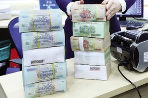 Nợ xấu đang có xu hướng tăng lên, ảnh hưởng đến hoạt động ngân hàng và mặt bằng lãi suất. Ảnh: Đức Thanh 