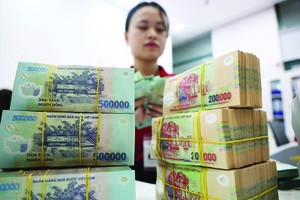 Nợ xấu ngân hàng đang có xu hướng gia tăng, trong khi xử lý nợ xấu gặp nhiều khó khăn. Ảnh: Dũng Minh 