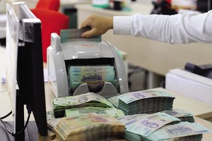 Việc sửa đổi đồng bộ hành lang pháp lý về xử lý nợ xấu sẽ kích thích thị trường nợ phát triển. Ảnh: Đức Thanh