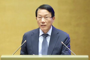  Bộ trưởng Bộ Công an Lương Tam Quang trình bày báo cáo. Ảnh: Duy Linh. 