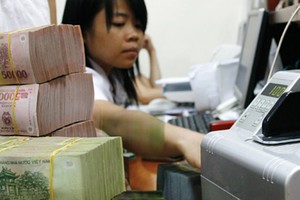 Giáp Tết, ngân hàng vẫn thừa tiền mặt
