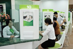 Giảm lãi suất để hỗ trợ DN, Vietcombank sẽ điều chỉnh kế hoạch lợi nhuận năm 2014 - Ảnh: Hoài Nam