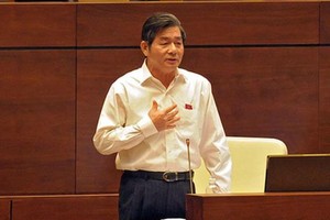 Bộ trưởng Bộ Kế hoạch và Đầu tư Bùi Quang Vinh nói về những điểm mới của Luật Đầu tư sửa đổi. Ảnh: Đức Thanh