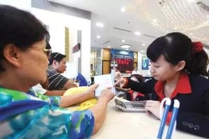 Thương vụ sáp nhập của Sacombank hoặc Maritime Bank được dự đoán sẽ mở đầu năm 2015. Ảnh: Lê Toàn