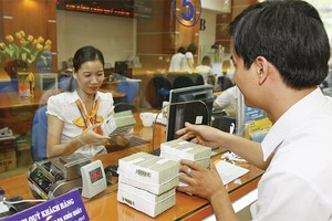 Đến 30/6/2015, các TCTD phải bán được tối thiểu 75% số nợ xấu theo chỉ tiêu được giao và đến 30/9/2015 phải bán hết 100%