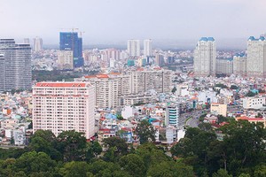 Tại Hà Nội và TP. HCM còn hàng chục ngàn căn hộ chung cư chưa được cấp sổ hồng - Ảnh: Lê Toàn