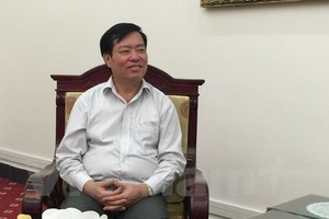 Chủ tịch Hội đồng Tiền lương quốc gia, Thứ trưởng Bộ Lao động -Thương binh và Xã hội Phạm Minh Huân dự đoán mức tăng lương sẽ trên 10%. Ảnh: Hồng Kiều/Vietnam+