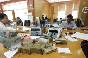 Điều chỉnh tỷ giá giúp tăng trưởng kinh tế thêm ít nhất 0,5%