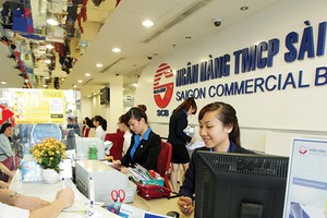 Theo các nhà băng, việc siết tín dụng bất động sản không ảnh hưởng nhiều đến các khoản vay của khách hàng cá nhân vay mua nhà. ảnh: Đức Thanh