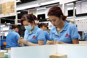 Sản xuất bao bì tại Công ty Goldsun cung cấp cho Samsung - doanh nghiệp FDI có đóng góp lớn nhất vào xuất khẩu của Việt Nam. Ảnh: Đức Thanh