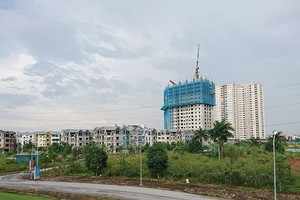 Bất động sản Long Biên được dự báo sẽ được hưởng lợi trong thời gian tới với kế hoạch xây thêm cầu/hầm Trần Hưng Đạo và cầu Vĩnh Tuy giai đoạn 2. Ảnh: Dũng Minh