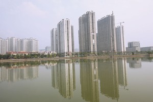 Nhà cao tầng là xu hướng tất yếu tại các đô thị lớn. Ảnh: Dũng Minh