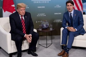 Tổng thống Trump gặp Thủ tướng Trudeau ngày 8/6 trong khuôn khổ Hội nghị thượng đỉnh G7. Ảnh: AFP