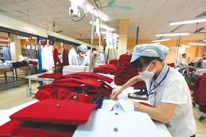 Doanh nghiệp vẫn phải công bố hợp quy sản phẩm dệt may theo Thông tư 21/2017/TT-BCT với nhiều bất hợp lý. Ảnh: Đ.T