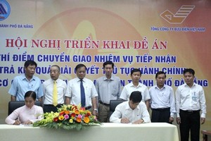 Các sở ngành, quận huyện TP Đà Nẵng ký kết thực hiện thí điểm đề án cung cấp dịch vụ công quan bưu điện