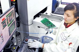 Sản xuất thiết bị điện tử tại Nhà máy Sparton Vietnam. Ảnh: Lê Toàn