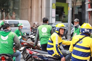 Chạy xe ôm công nghệ được xem là cá nhân kinh doanh nên đóng thuế thu nhập. Ảnh: Ngọc Dương