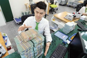 Dư địa giảm trích lập dự phòng rủi ro cho các ngân hàng không lớn. Ảnh: Đức Thanh