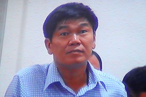 Ông Trần Đình Long tại phiên tòa xét xử bầu Kiên sáng 30/5 (ảnh chụp qua màn hình)