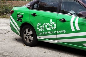 Grab hiện là đối thủ lớn nhất của Uber tại Đông Nam Á. Ảnh: Bloomberg