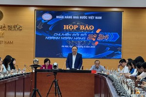 Ông Phạm Anh Tuấn, Vụ trưởng Vụ Thanh toán, NHNN phát biểu tại Họp báo.