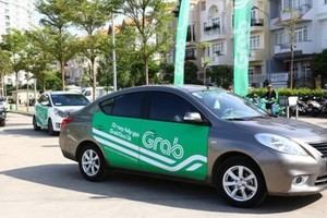 Các xe tham gia thí điểm hợp đồng điện tử phải gắn logo để phân biệt. Ảnh minh họa: Xuân Hoa