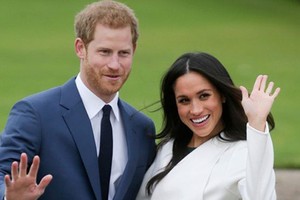 Hoàng tử Anh Harry và hôn thê Markle. Ảnh: AFP
