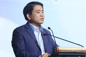 Chủ tịch UBND TP Hà Nội Nguyễn Đức Chung phát biểu tại hội thảo về cây xanh, hồ nước sáng 13/1. Ảnh: Võ Hải