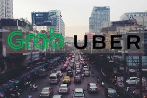 Grab và Uber Đông Nam Á liệu có về chung một nhà trong tương lai? Ảnh: Kr-asia.