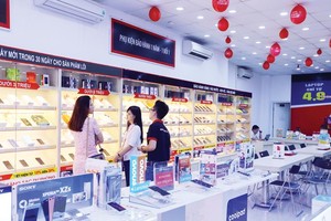FPT giảm tỷ lệ sở hữu tại FPT Trading và FPT Retail, để tập trung vào mảng kinh doanh truyền thống là công nghệ. Ảnh: Đức Thanh