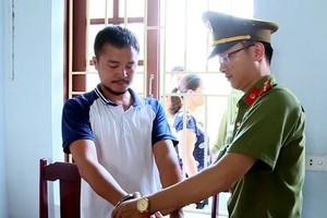 Nguyễn Duy Sơn bị cơ quan công an bắt giữ.