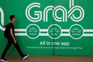 Bên ngoài một văn phòng của Grab tại Singapore. Ảnh: Reuters.