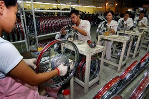 Cuộc chiến thương mại Mỹ - Trung đã khiến các doanh nghiệp đổ xô vào đầu tư tại Việt Nam và các nước Đông Nam Á khác. (Nguồn: Xinhua).