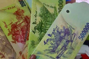 Việc in ấn, mua bán bao lì xìhình tiền Việt Là hành vi vi phạm. Ảnh:PV.