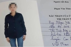 Lá đơn của ông Phạm Văn Thìn đính kèm ảnh con gái Phạm Thị Trà My. Ảnh:Đức Hùng.