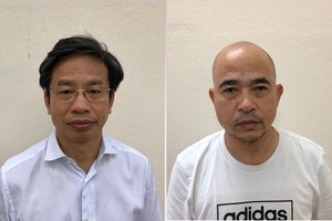 Bị can Nguyễn Xuân Sơn (trái) và Vũ Trọng Hải.