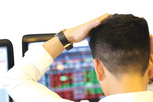 Tình trạng treo lệnh thường xảy ra khi thanh khoản của sàn HOSE chạm ngưỡng 14.000 tỷ đồng trong phiên. Ảnh: Dũng Minh.