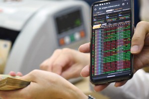 Nền kinh tế vẫn đang cần chính sách tiền tệ nới lỏng để thúc đẩy tăng trưởng. Ảnh: Dũng Minh.