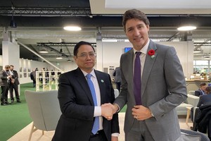 Thủ tướng Chính phủ Phạm Minh Chính và Thủ tướng Canada Justin Trudeau - Ảnh: TTXVN.